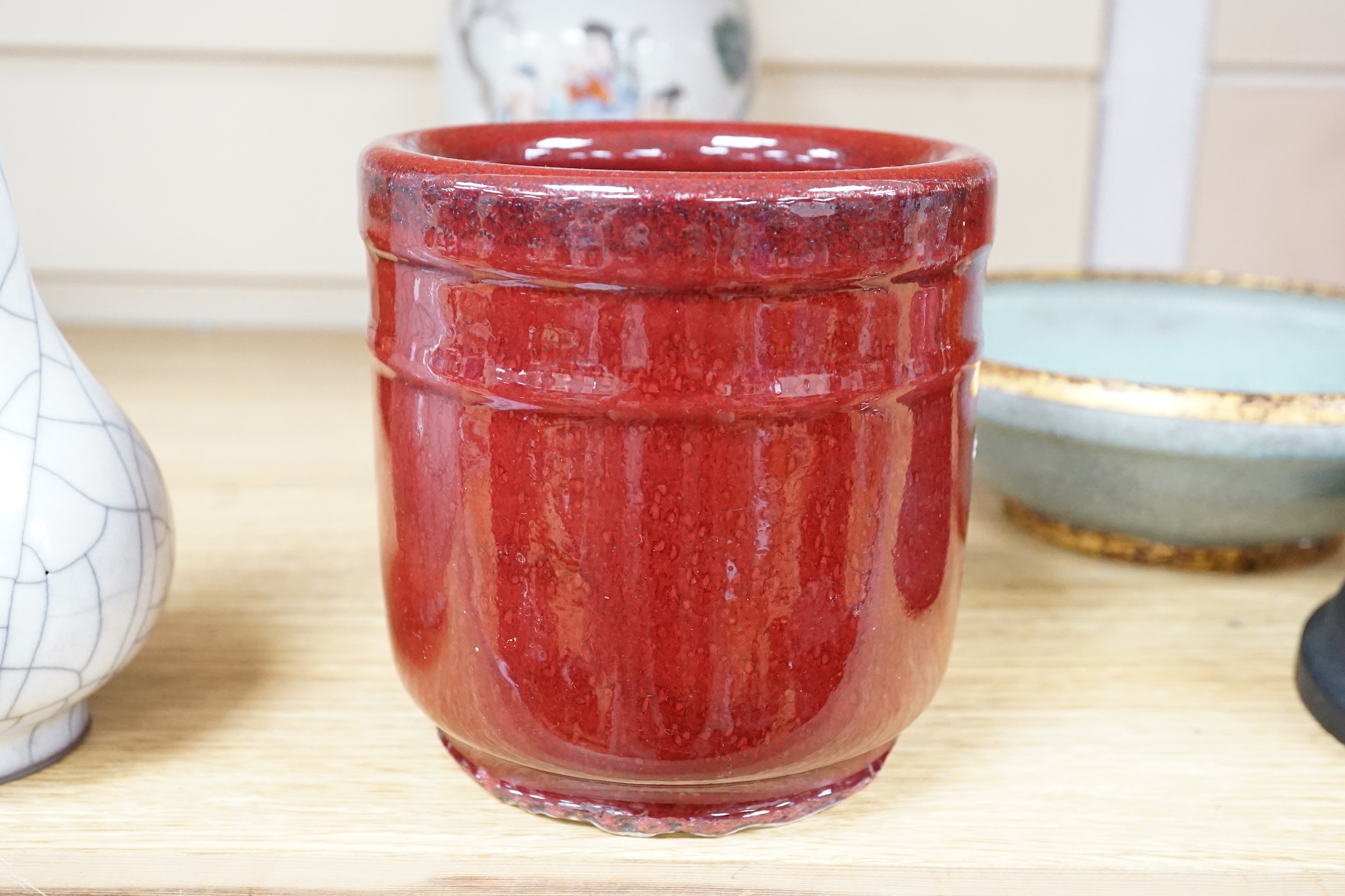 A Chinese famille rose vase, a crackle glaze vase and a sang de boeuf jar, tallest 21.5cm